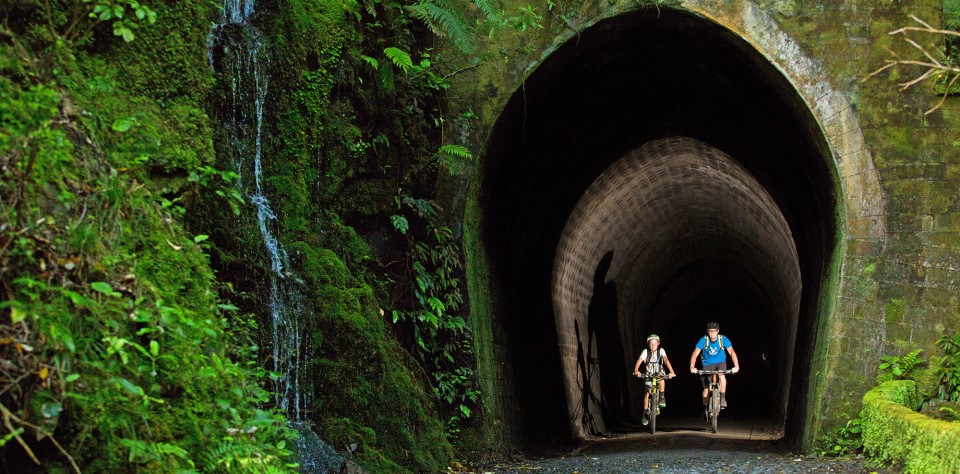 Remutaka Cycle Trail tunnel Two cyclists in Summit Tunnel with headlamps credit Caleb Smith